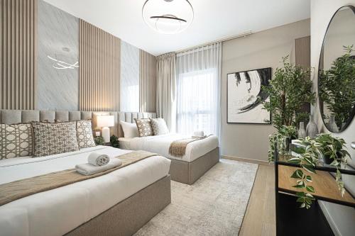 a large bedroom with two beds and a couch at Luxury 4 Bedroom Apartment with Ferrari World and Sea Views, Yas Island Waterfront, Pool, Gym, Playground, Walk to Yas Mall in Abu Dhabi