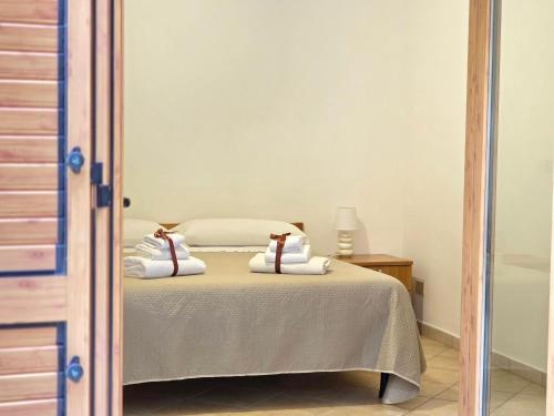 a bedroom with a bed with two pillows on it at Oasi Relais in Vico Equense