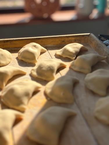 a tray of dumplingooked food on a table at Lacul Racilor in Olimp