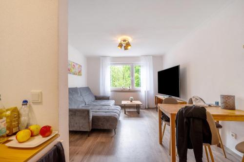 a living room with a couch and a table at Bed and Breakfast St Wendel in Prüm