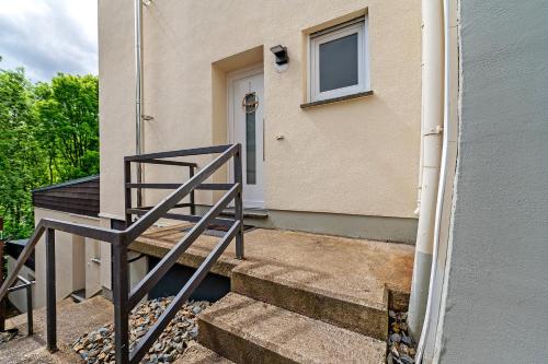 a set of stairs in front of a house at Bed and Breakfast St Wendel in Prüm