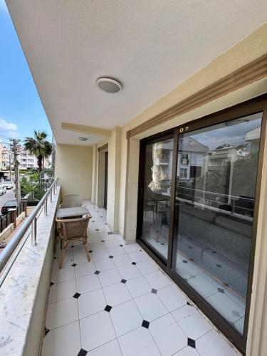 a balcony with a table and chairs on a building at Metropolitan apart in Marmaris