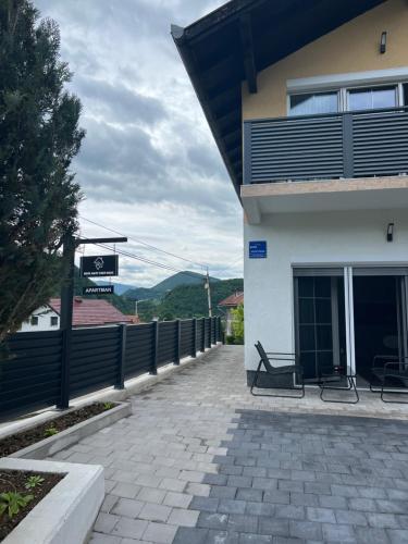 a bench sitting outside of a building at Home Away From Home 2 in Jajce