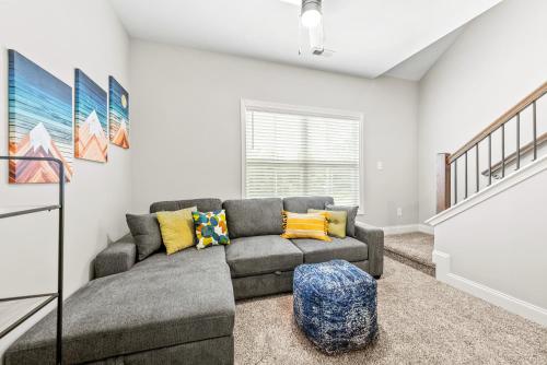 a living room with a couch and a staircase at 1014 Franklin Street in Clarksville