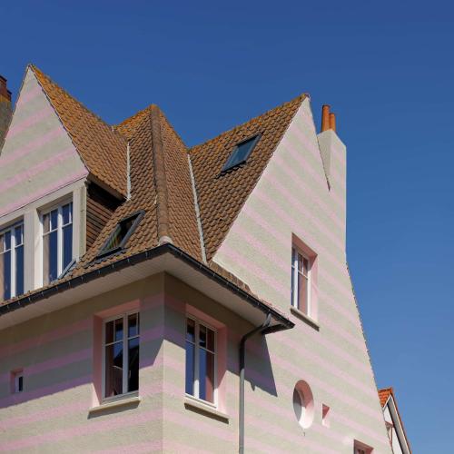a house with a shingled roof at TheVillaRose in Wimereux