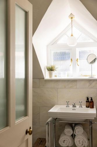 a bathroom with a sink and a window at Fern House in Dorchester