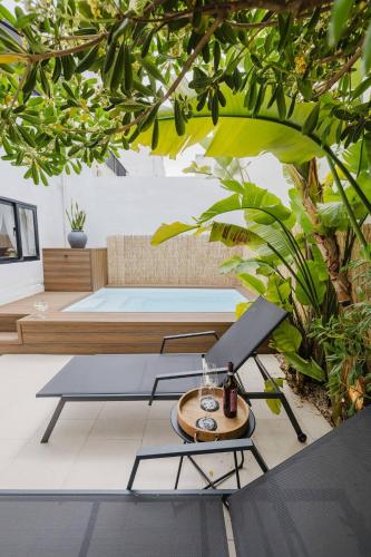 a living room with a table and a couch at The Rustique - 3BED house in Mellieha by Homely! in Ix-Xagħra taʼ Barra