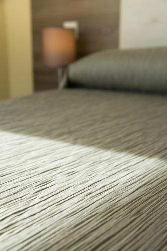 a close up of a bed in a bedroom at Villas Altos De Marbella in Marbella
