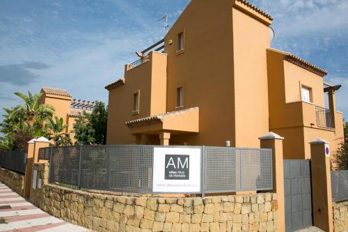 a building with a sign in front of it at Villas Altos De Marbella in Marbella