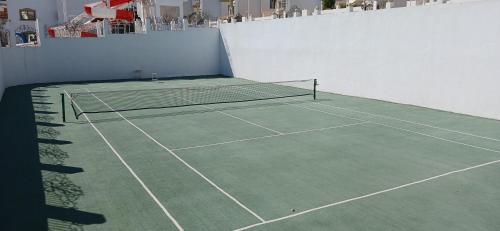 a tennis court with two tennis rackets on it at Sharm hills sea view in Sharm El Sheikh