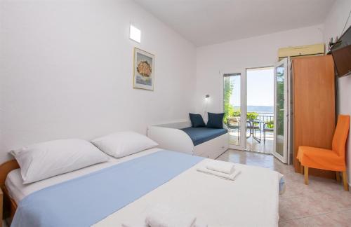 Postel nebo postele na pokoji v ubytování Apartments Zorica