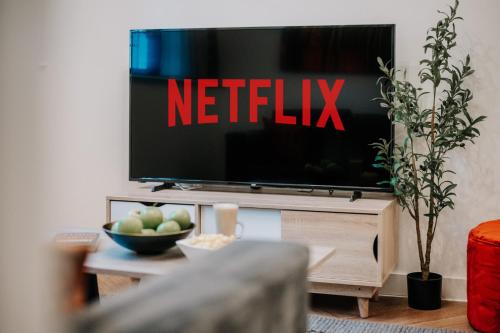 a television with a netflix sign on it in a living room at Luxury Two Bedroom Birmingham City Centre Apartment in Birmingham
