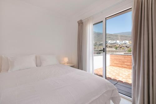 Ένα ή περισσότερα κρεβάτια σε δωμάτιο στο Private Villa Candelaria