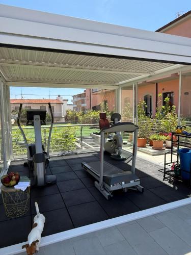 a gym on the roof of a house at Hotel Lucerna in Castiglione della Pescaia