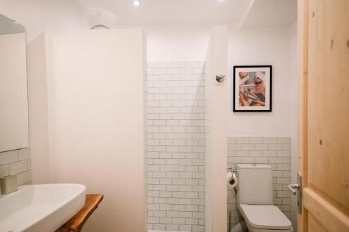 a bathroom with a toilet and a sink at Steinhaus mit Dachterrasse und Badefluss in Ribaute