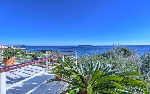 a balcony with a view of the ocean at Villa Tempera in Vis
