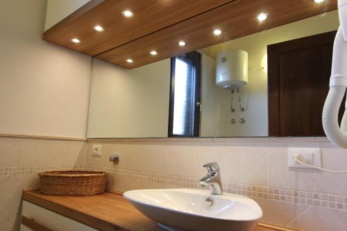 a bathroom with a sink and a mirror at Borgo Antico in Diso