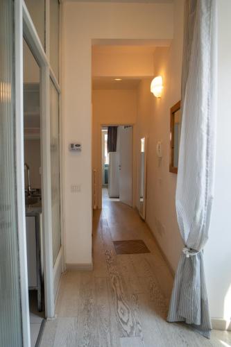 a hallway of a house with a curtain on the floor at La Dimora alle Scalette in Orvieto
