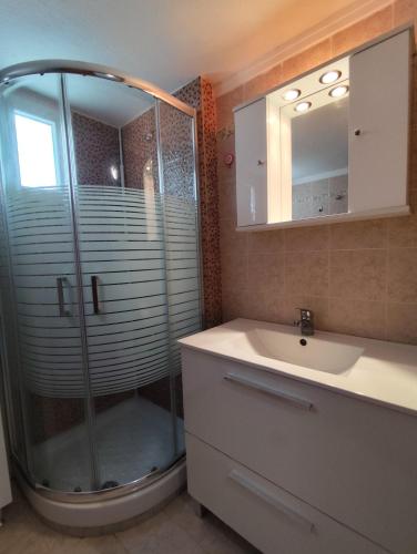 a bathroom with a shower and a sink at Nikiti Blue Horizon in Nikiti