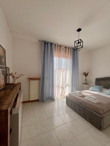 Postel nebo postele na pokoji v ubytování Garda Lake Holiday Apartments quadrilocale