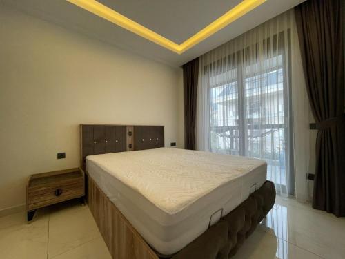 Ένα ή περισσότερα κρεβάτια σε δωμάτιο στο cosy flat, Kleopatra beach