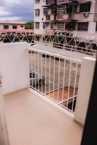 a balcony with a view of a building at Hana Homestay in Tawau