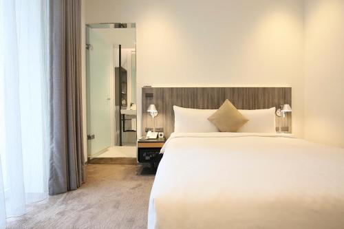 Postel nebo postele na pokoji v ubytování Dandy Hotel - Tianjin Branch