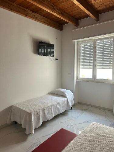 Postel nebo postele na pokoji v ubytování Villetta Lucia