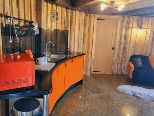 a kitchen with a counter and a sink in a room at The Stables & Silos in Braintree