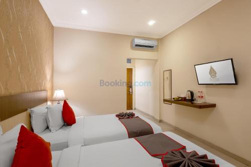 Katil atau katil-katil dalam bilik di The Kanjeng Hotel Kuta