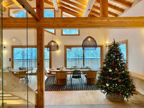 a living room with a christmas tree in the middle at Chalet Asgard in Morzine