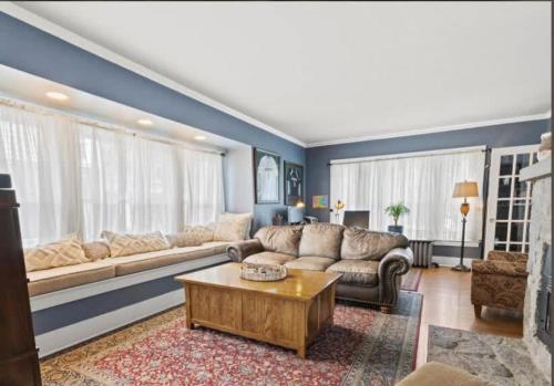 a living room with a couch and a coffee table at Majestic Family Home in Saratoga New York in Saratoga Springs