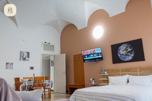 TV a/nebo společenská místnost v ubytování Le Camelie