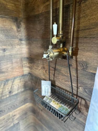 a metal rack on the wall of a bathroom at The Stables & Silos in Braintree