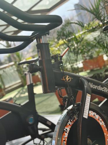 a black bike parked in front of a building at Hotel Casa Victoria in Medellín