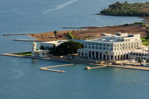 a large white building on an island in the water at Marchica Lagoon Resort in Nador
