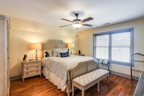 a bedroom with a bed and a ceiling fan at Farm and Lake Views Rural Mississippi Loft Apt in Hernando