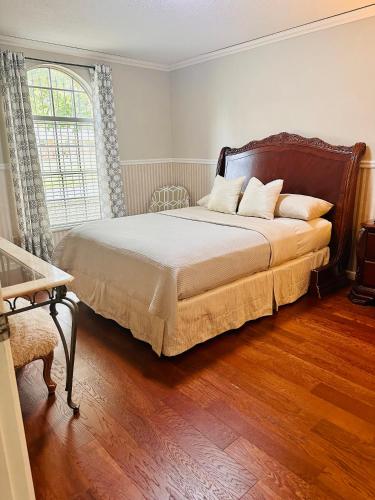 a bedroom with a bed and a large window at Nice and peaceful bedroom in Wake Village