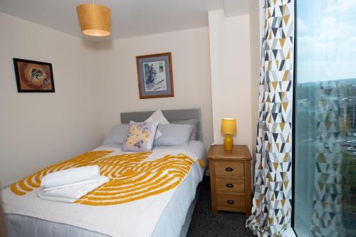 a bedroom with a bed and a window at Pitchdip Accommodation in Bradford