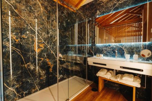 a bathroom with a sink and a shower at Quinta S Pedro - Arouca Valley in Arouca
