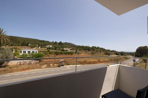 a view of a road from the balcony of a house at Ses Arcades in Sant Joan de Labritja