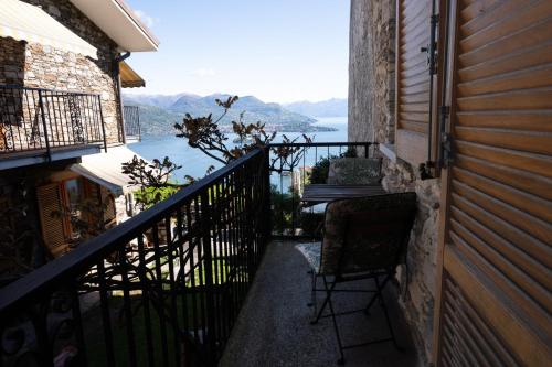 a balcony of a house with a view of the water at Casa Orfea in Stresa