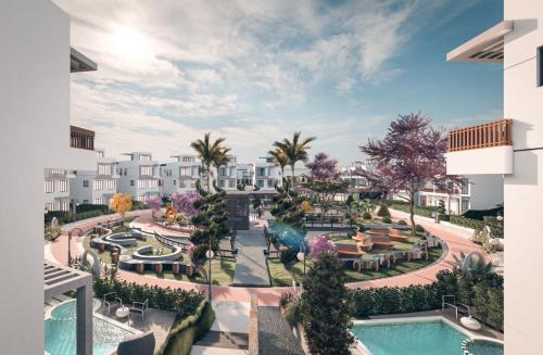 une vue aérienne d'un complexe hôtelier avec piscine dans l'établissement فيلا بالشيخ زايد, à Sheikh Zayed