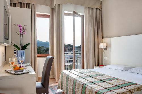 Postel nebo postele na pokoji v ubytování Hotel Caravel