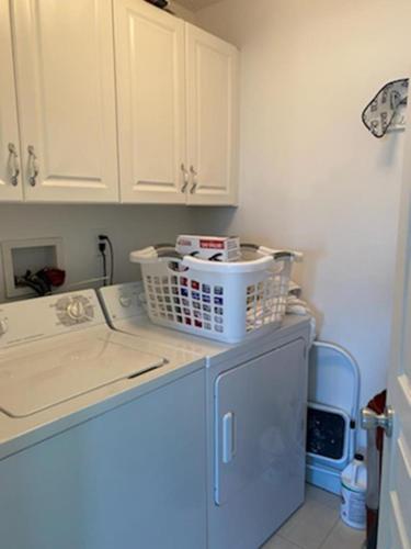 a kitchen with a dish basket on top of a dishwasher at Lagoon Front, Loveladies, Dock, Decks, Beach Badges, Bikes, Ping Pong Table, Foosball, Wifi,gorgeous Reverse-Living Loveladies Contemporary On A, in Loveladies