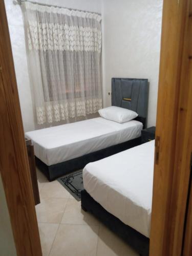 Ένα ή περισσότερα κρεβάτια σε δωμάτιο στο Appartement Confortable à Louer