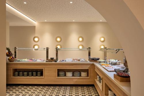 a dressing room with two mirrors on the wall at Kimpton Los Monteros Marbella by IHG in Marbella