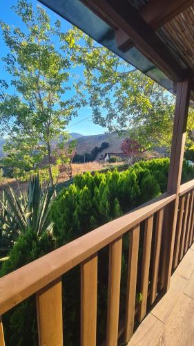 a balcony with a view of a garden at la noach in Metulla