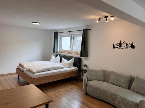 Ένα ή περισσότερα κρεβάτια σε δωμάτιο στο Apartment im Souterrain mit Terrasse