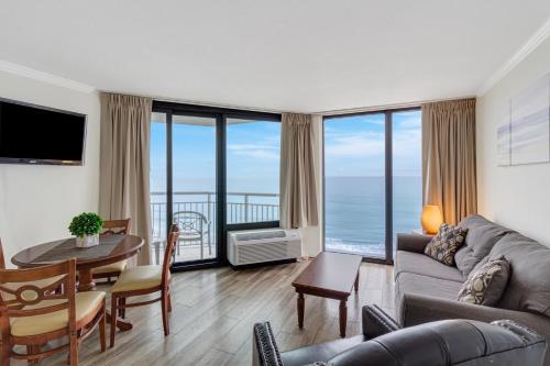 a living room with a view of the ocean at Impressive 1Br Oceanfront Suite, Dogs OK! 1006 in Myrtle Beach